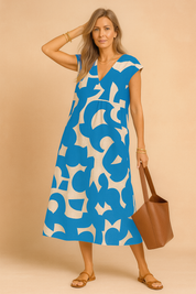 Blauwe midi-jurk met abstracte print en V-hals