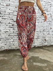 Stilfuld boho-chic bukser med behagelig smocket talje og unik etnisk print