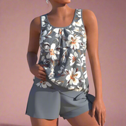 Donkergrijze dames pyjamaset met grote witte bloemenprint en mouwloos hemdje met bijpassende shorts.