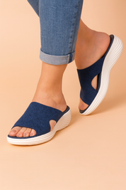 Dames instap slippers met sportieve look en golvende platformzool