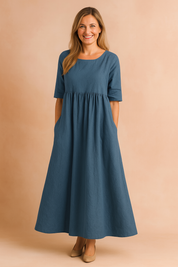 Petrolblauwe midi-jurk met hoge taille, linnenlook en wijd uitlopende rok met steekzakken